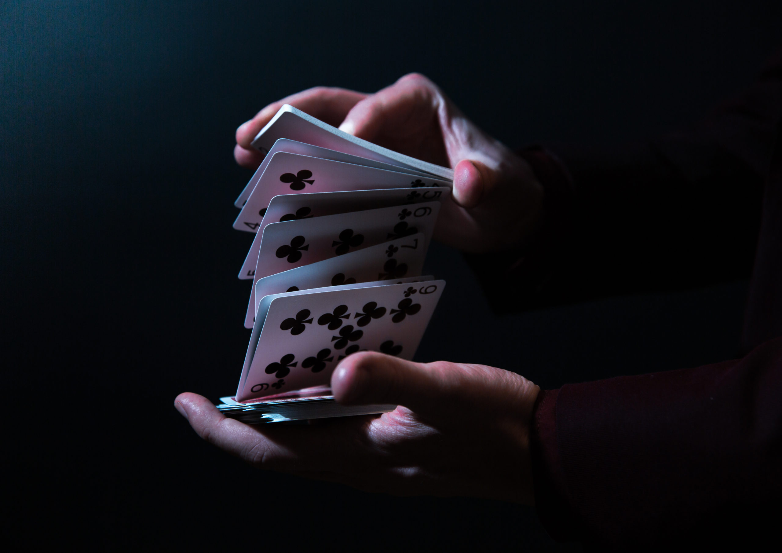 magician hands with playing cards